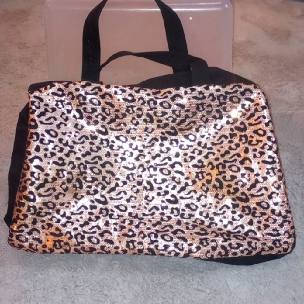 Sequined and canvas leopard print duffel bag